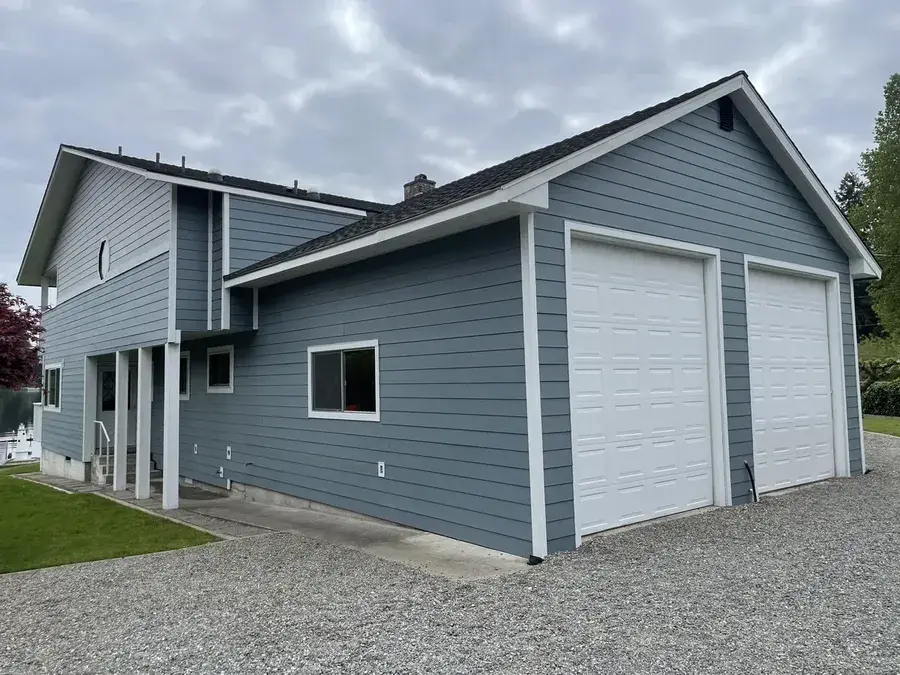 Blue-gray lap siding with white trim near Tacoma, WA